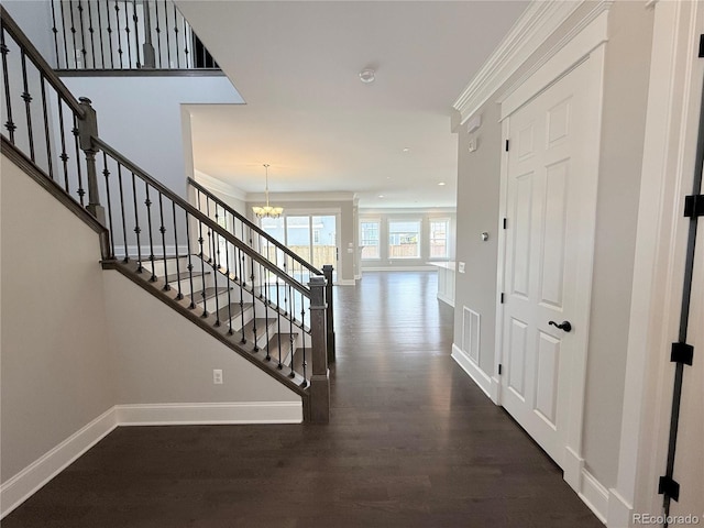 6023 Chester Way, Denver, CO 80238 - stairway featuring a chandelier, baseboards, wood finished floors, and recessed lighting
