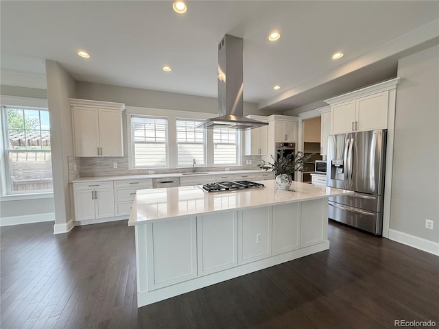 6023 Chester Way, Denver, CO 80238 - kitchen featuring appliances with stainless steel finishes, island exhaust hood, a sink, baseboards, and white cabinets