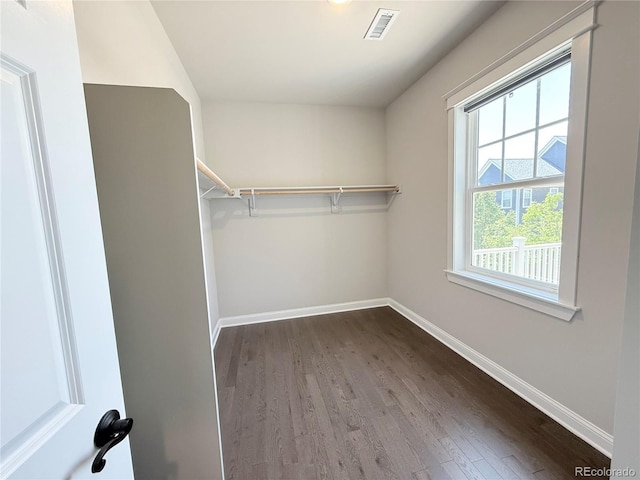 6023 Chester Way, Denver, CO 80238 - walk in closet featuring dark wood finished floors