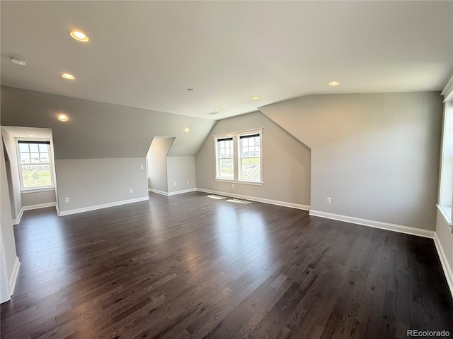 6023 Chester Way, Denver, CO 80238 - additional living space with dark wood-style flooring, baseboards, lofted ceiling, and recessed lighting