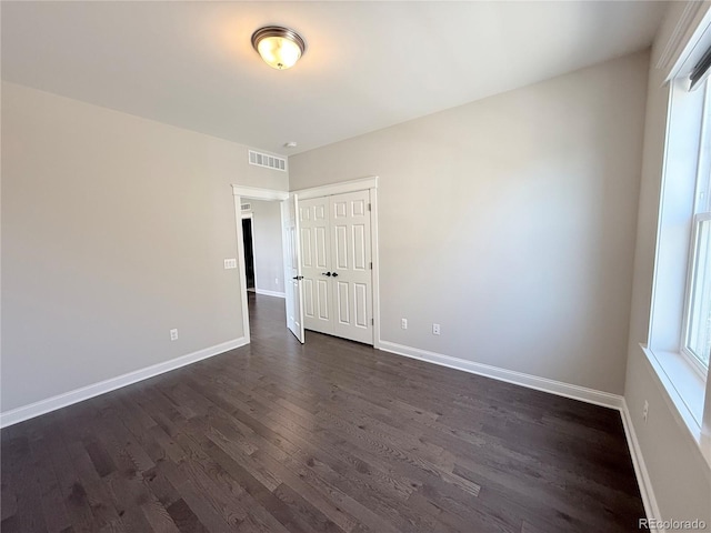 6023 Chester Way, Denver, CO 80238 - spare room with dark wood-type flooring and baseboards