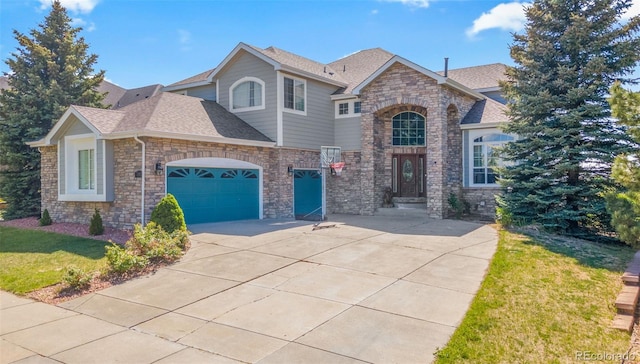 24022 E Jamison Dr, Aurora, CO 80016 - view of front facade featuring driveway, an attached garage, a front lawn, roof with shingles, and stone siding