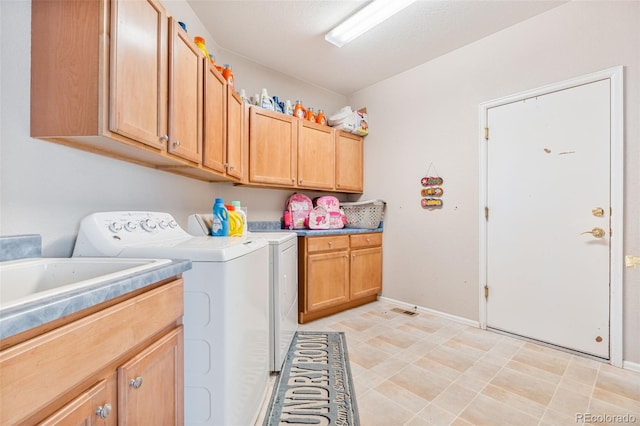24022 E Jamison Dr, Aurora, CO 80016 - laundry area featuring cabinet space, washing machine and dryer, and baseboards