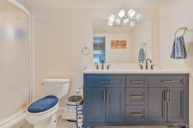 24022 E Jamison Dr, Aurora, CO 80016 - bathroom featuring toilet, double vanity, a shower, and baseboards