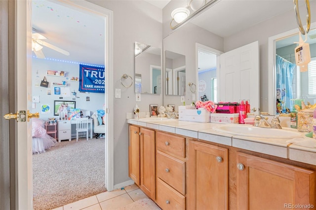24022 E Jamison Dr, Aurora, CO 80016 - ensuite bathroom featuring double vanity, tile patterned flooring, and ceiling fan