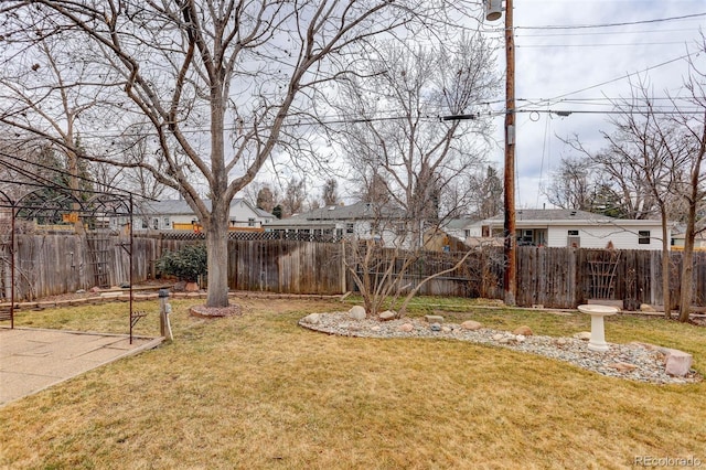 view of yard with a fenced backyard