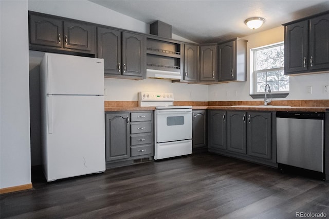 711 Clark St, Fairplay, CO 80440 - kitchen with dark wood finished floors, a sink, lofted ceiling, under cabinet range hood, and white appliances