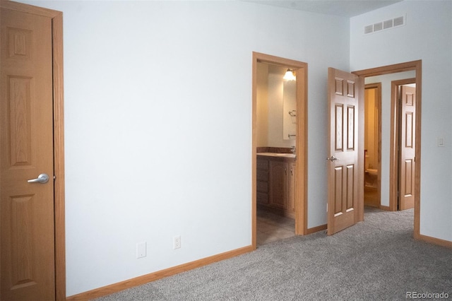 711 Clark St, Fairplay, CO 80440 - unfurnished bedroom featuring visible vents, carpet, ensuite bathroom, and baseboards
