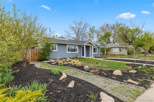 view of front of property featuring fence