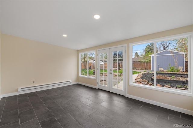 unfurnished room with recessed lighting, french doors, baseboards, dark tile patterned flooring, and a baseboard radiator