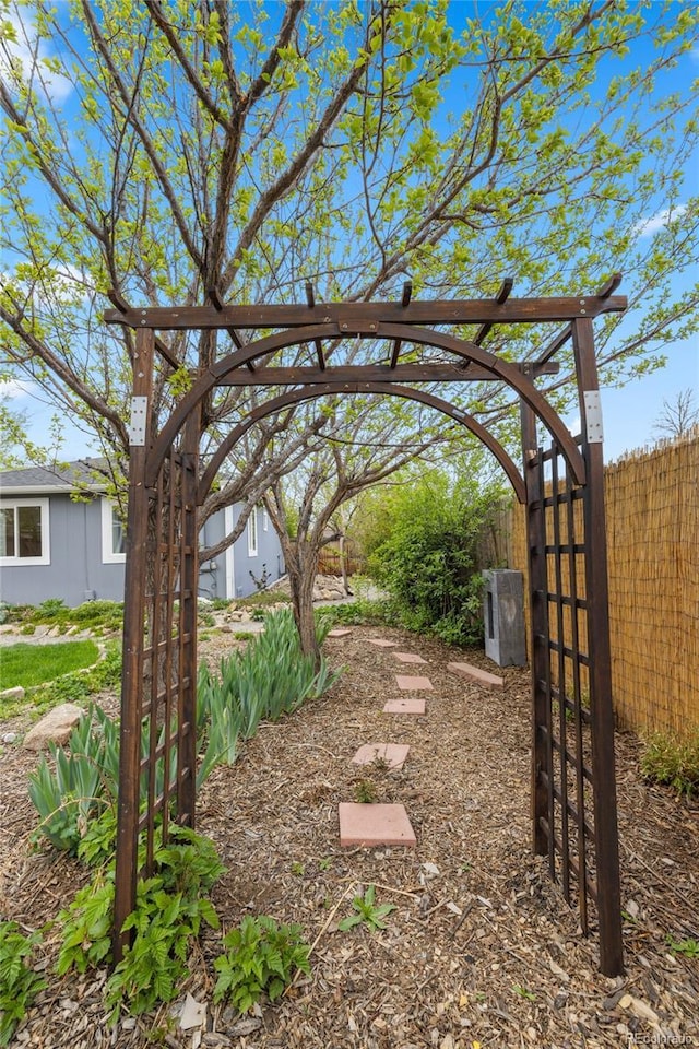 view of yard featuring fence and a gate