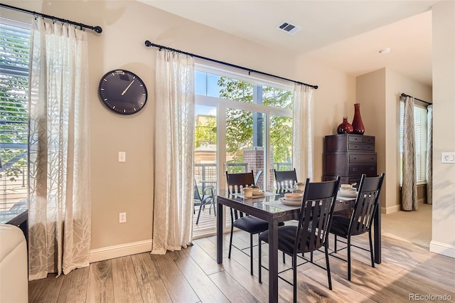 5401 S Park Terrace Ave Unit 109A, Greenwood Village, CO 80111 - dining area with baseboards and wood finished floors