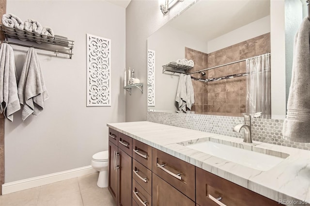 5401 S Park Terrace Ave Unit 109A, Greenwood Village, CO 80111 - bathroom with tiled shower, vanity, toilet, tile patterned flooring, and tasteful backsplash