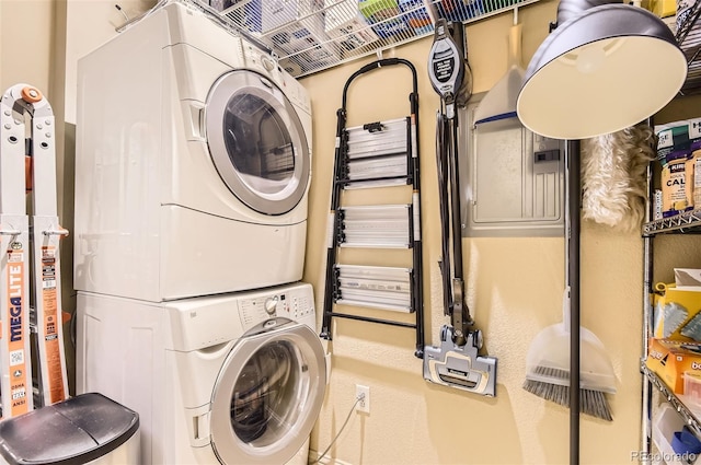 5401 S Park Terrace Ave Unit 109A, Greenwood Village, CO 80111 - clothes washing area featuring stacked washer and clothes dryer
