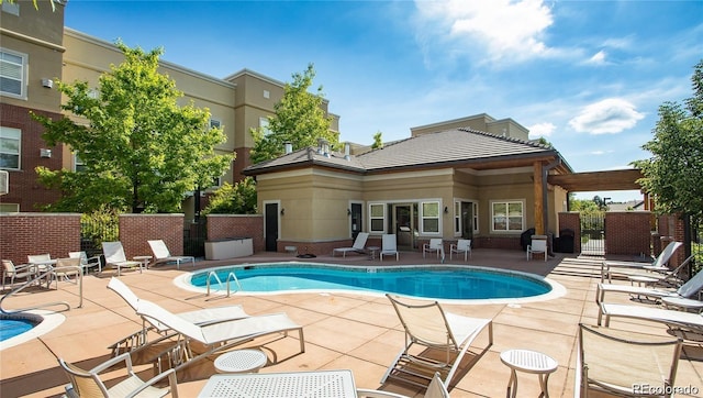 5401 S Park Terrace Ave Unit 109A, Greenwood Village, CO 80111 - community pool featuring fence, a patio, and a gate