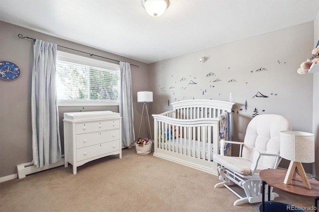 bedroom featuring a nursery area and light carpet
