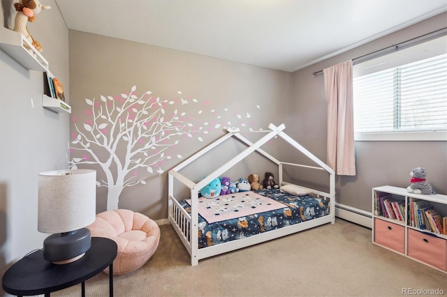 bedroom with carpet flooring and a baseboard heating unit