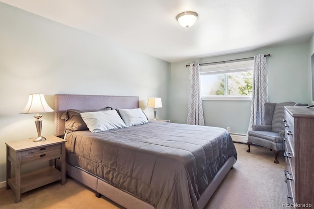 carpeted bedroom featuring baseboards and a baseboard heating unit