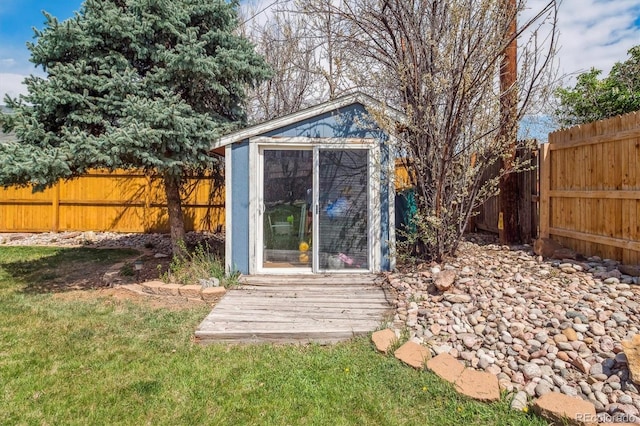view of shed with a fenced backyard