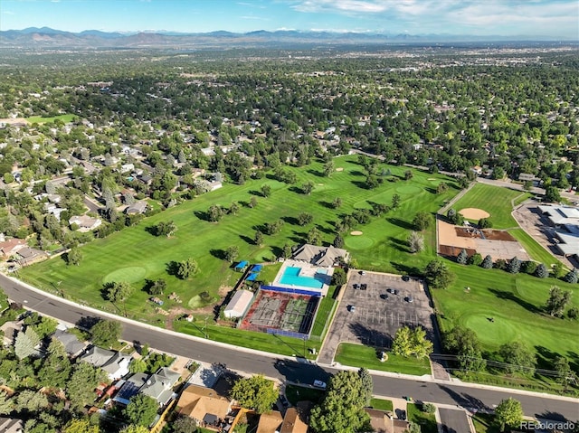 aerial view featuring view of golf course and a mountain view