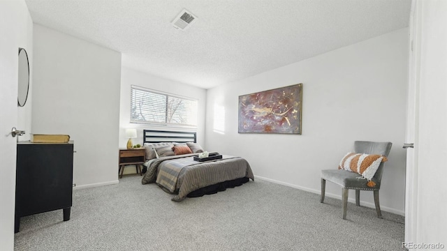 carpeted bedroom with a textured ceiling