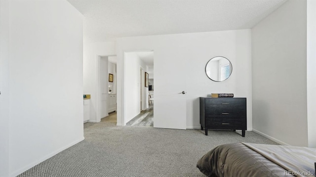 carpeted bedroom with a textured ceiling