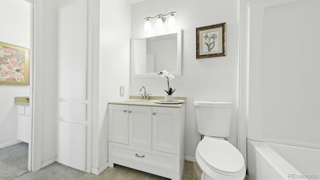 bathroom with toilet and vanity