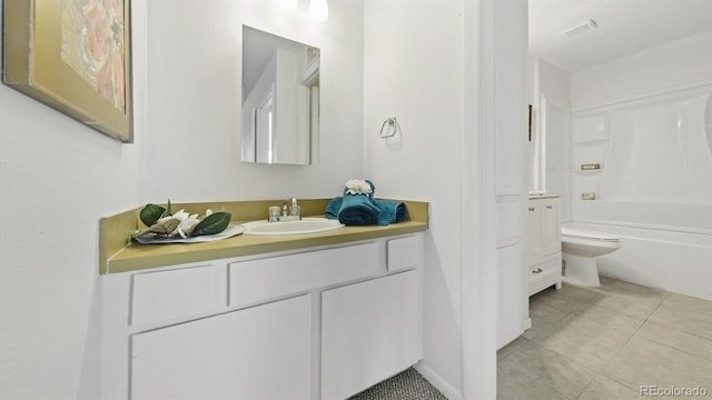 full bathroom with toilet, vanity, tile patterned floors, and shower / tub combination