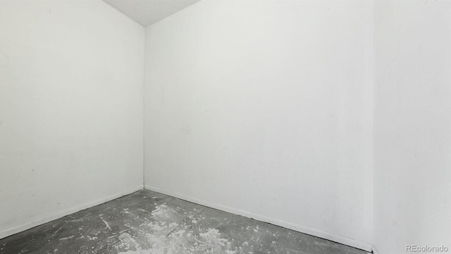 empty room featuring a textured ceiling