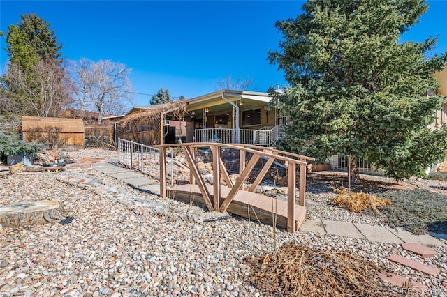 view of front of home featuring covered porch