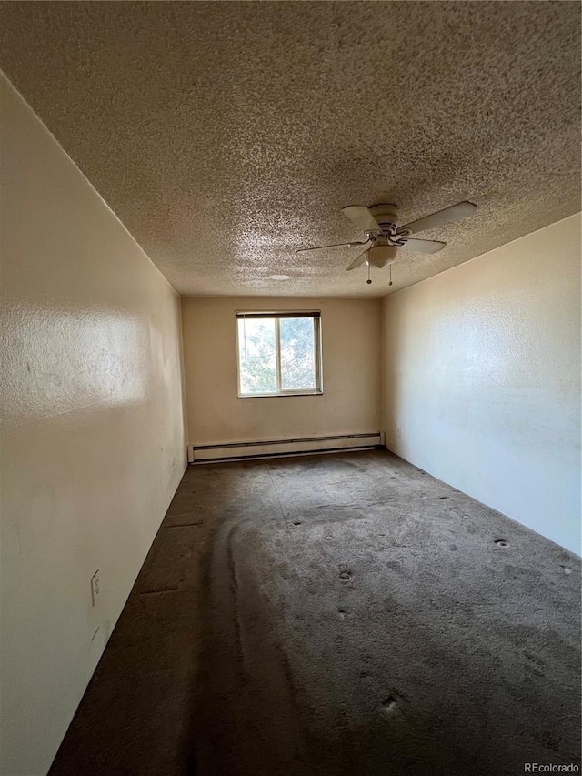 carpeted spare room with baseboard heating, ceiling fan, and a textured ceiling