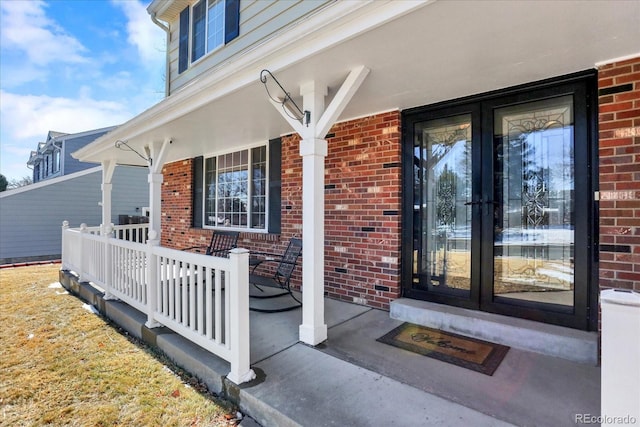 property entrance with french doors and a porch