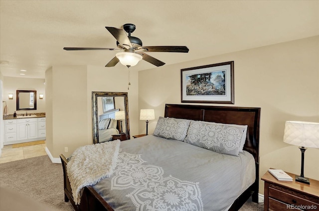 7631 Oak St, Arvada, CO 80005 - bedroom featuring ensuite bath, a ceiling fan, and light carpet