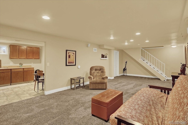 7631 Oak St, Arvada, CO 80005 - living area with light carpet, stairway, and recessed lighting