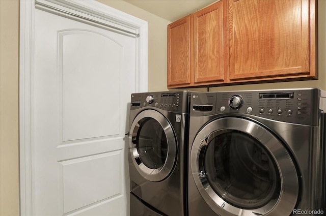 7631 Oak St, Arvada, CO 80005 - laundry room with cabinet space and washing machine and dryer