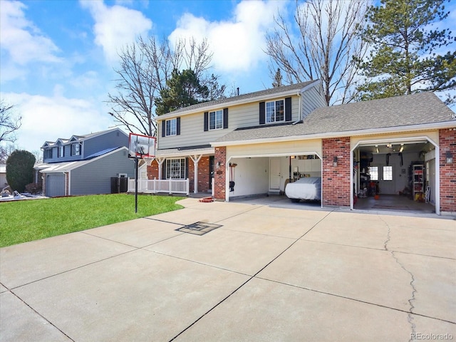7631 Oak St, Arvada, CO 80005 - traditional-style home with concrete driveway, brick siding, a front lawn, covered porch, and a garage