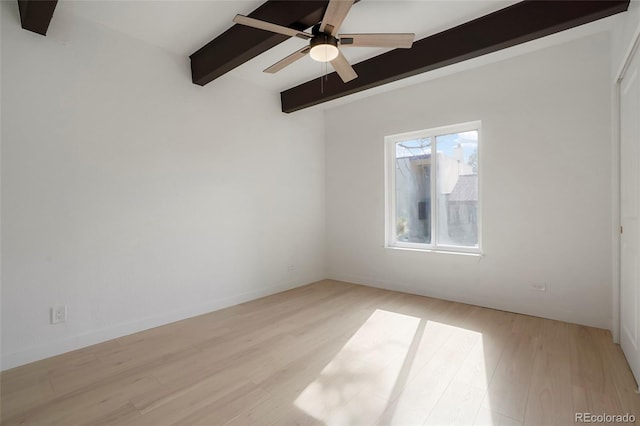 spare room featuring beamed ceiling, ceiling fan, and light hardwood / wood-style flooring