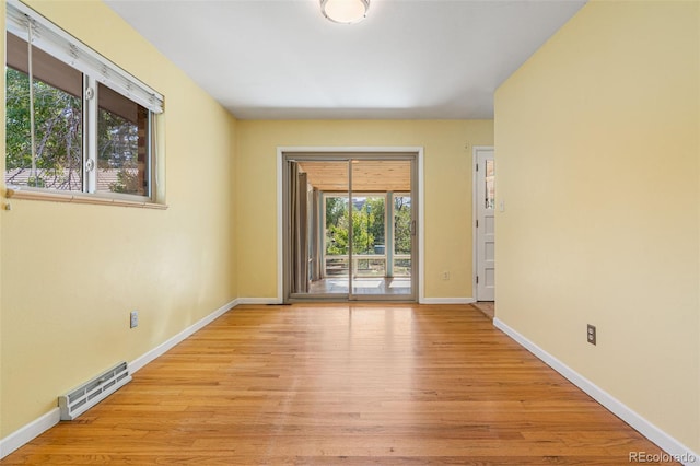 unfurnished room featuring light hardwood / wood-style flooring