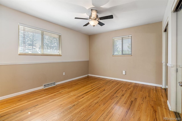 spare room featuring ceiling fan and light hardwood / wood-style flooring