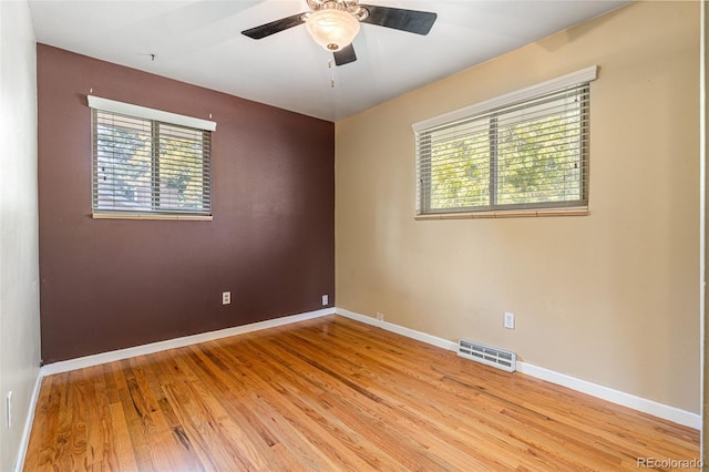 spare room with ceiling fan and light hardwood / wood-style flooring