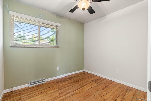 empty room with light hardwood / wood-style floors and ceiling fan