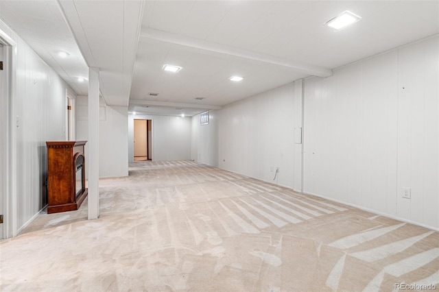 basement featuring light colored carpet