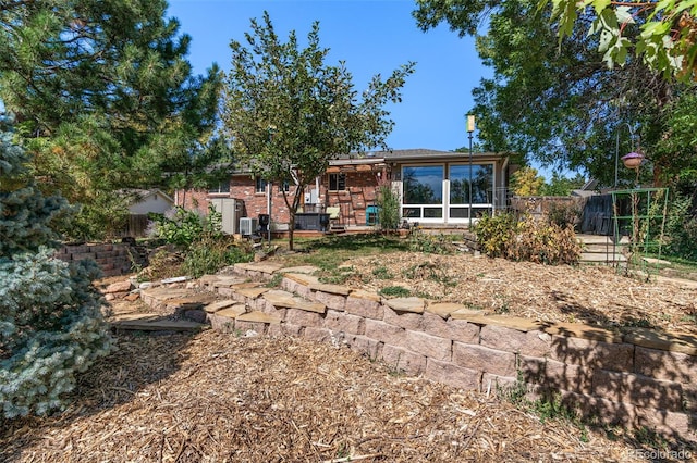 rear view of house with a sunroom