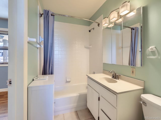 full bathroom featuring tile patterned floors, vanity, toilet, and shower / bath combination with curtain