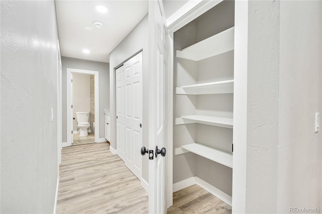 hallway featuring light hardwood / wood-style flooring