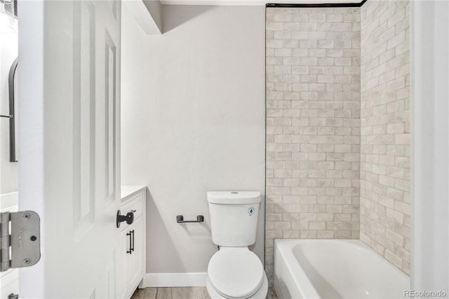 full bathroom with toilet, vanity, and tiled shower / bath combo