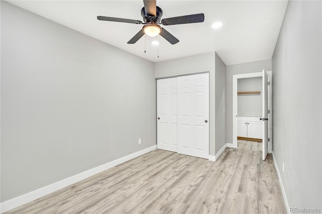 unfurnished bedroom featuring light wood-type flooring, ceiling fan, and a closet