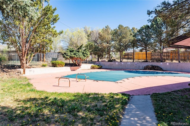 view of pool with fence