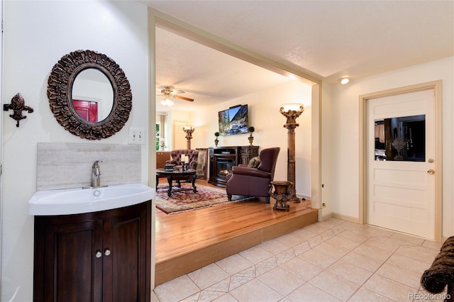 5215 S Washington St, Littleton, CO 80121 - hall featuring a sink and light tile patterned flooring