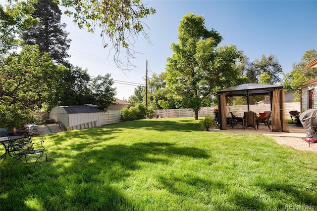 5215 S Washington St, Littleton, CO 80121 - fenced backyard featuring a gazebo, a storage shed, and a patio